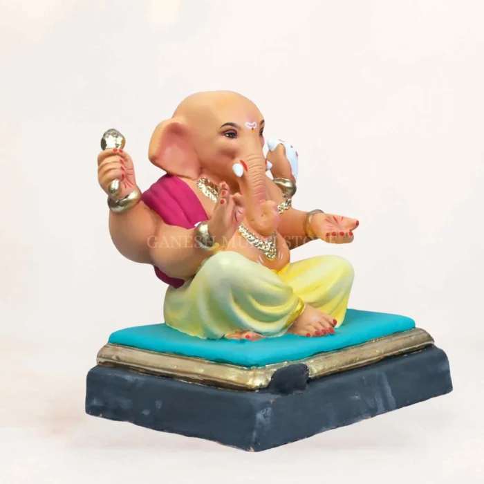 Handcrafted clay Ganesha murti online booking 12 inch Ambuja yellow color eco friendly idol front look.