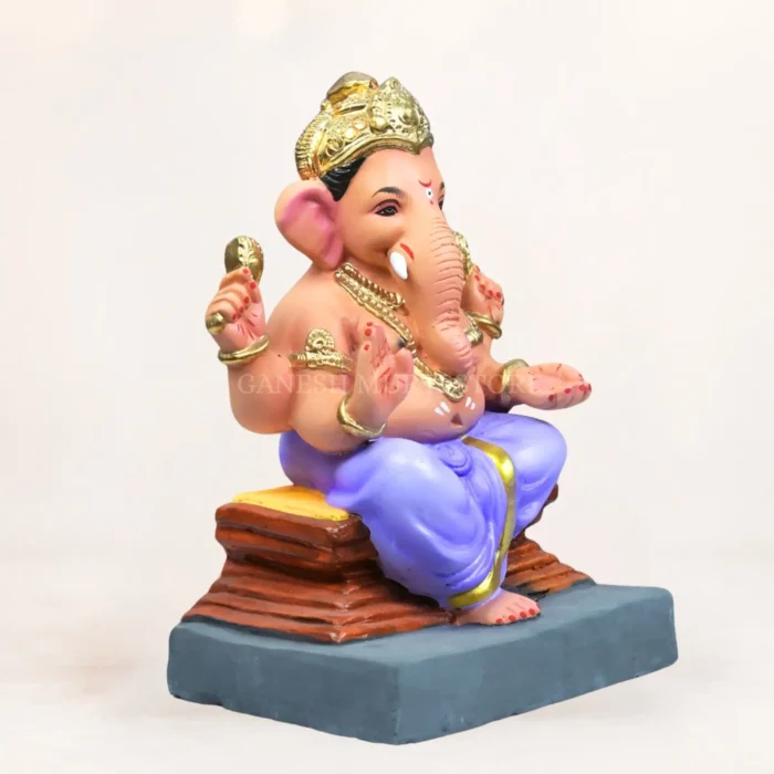 Alt Text: Handcrafted 12 inch light purple clay Ganesh idol on a chaurang pedestal for home puja