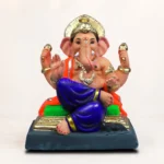 eco-friendly Ganesha idol made from dark grey natural clay, detailed with red religious markings on the forehead, trunk, and crown.