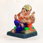 natural eco-friendly Ganesha idol sculpted from light-colored clay, depicted with a smooth finish and a minimalist traditional headdress.