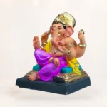 Sumukha eco-friendly Ganesha idol in a meditative posture, adorned with a golden crown and yellow dhoti.