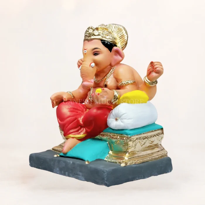 Eco friendly Ganesha statue India, 12 inch Kainchi Load clay Ganpati murti in red dhoti by Ganesh Murti Store.