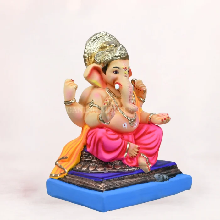 Side angle of Lambodar Pink Dhoti 18 Inch Eco-Friendly Ganpati Murti handcrafted from natural Shadu Mati clay.