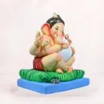 Close-up of Modak Bal Red Dhoti 16 Inch Shadu Mati Eco-Friendly Ganpati Idol with premium handcrafted detailing.