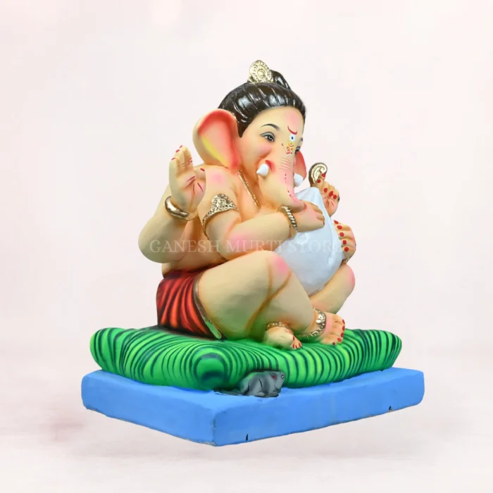 Close-up of Modak Bal Red Dhoti 16 Inch Shadu Mati Eco-Friendly Ganpati Idol with premium handcrafted detailing.