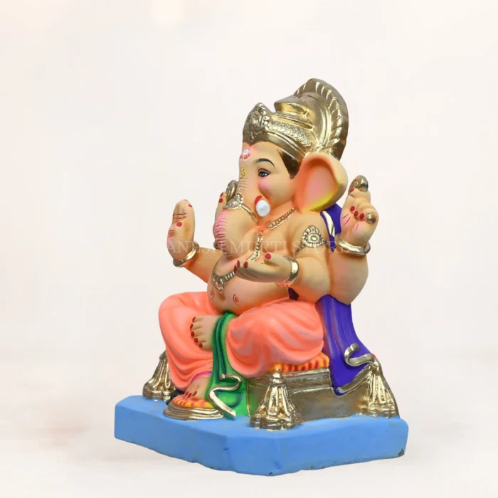Side angle of Philips Light Orange Dhoti 15 Inch Eco Friendly Ganpati Murti handcrafted from biodegradable clay.