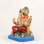 Side angle of Philips Orange Dhoti 15 Inch Eco Friendly Ganpati Murti handcrafted with natural clay.