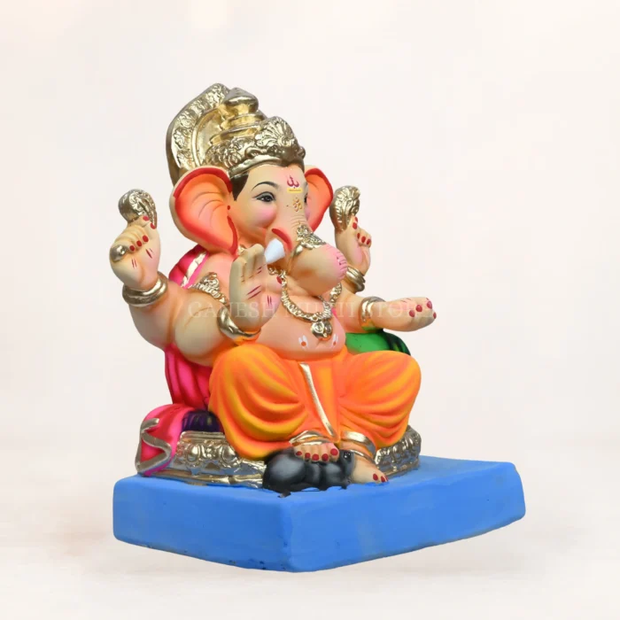 Round Aasan Load Yellow Dhoti 15 Inch Eco-Friendly Ganpati Murti made from natural Shadu clay with vibrant yellow dhoti for Ganesh Chaturthi celebration.