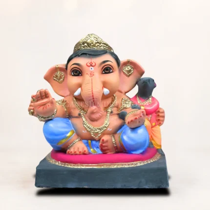 Biodegradable clay Ganesh idol with vibrant eco-safe colors and traditional Indian craftsmanship.