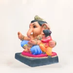 Hand-painted biodegradable Ganesh idol with vibrant eco-friendly colors.