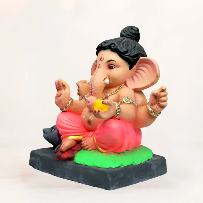 Vibrant 14 inch eco friendly Ganesha murti handmade with shadu matti, showcasing a traditional pink dhooti layout.