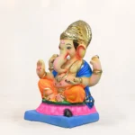 Close-up of Upra Kamal Yellow Dhoti 15 Inch Eco Friendly Ganpati Idol with intricate handcrafted Shadu clay detailing.