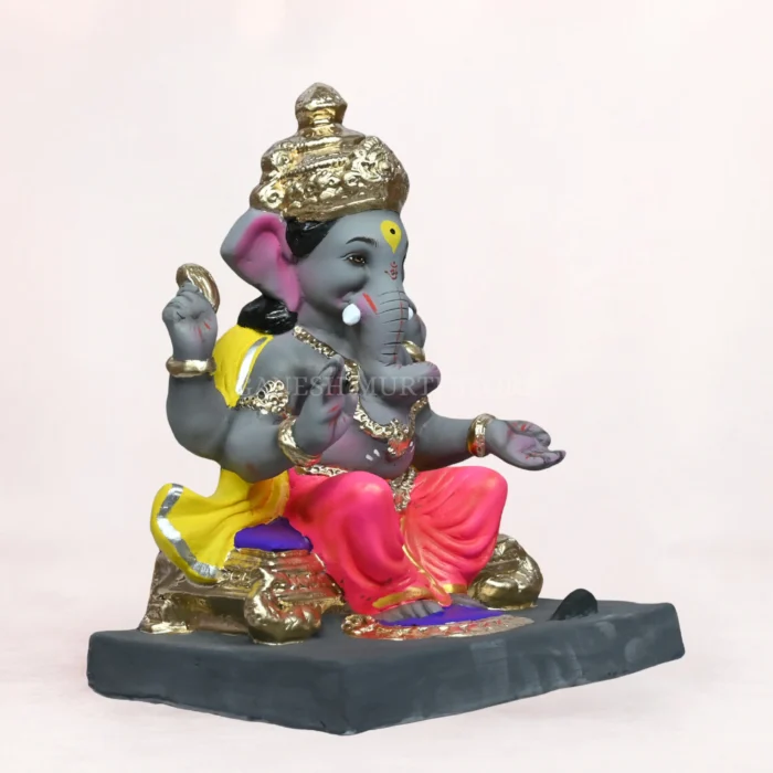 Side angle of Vithu Singhaasan Pink Dhoti 14 Inch Eco-Friendly Ganpati Murti handcrafted from natural clay.