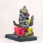 Close-up of Vithu Singhaasan Pink Dhoti 14 Inch Eco-Friendly Ganpati Murti with intricate handcrafted detailing.