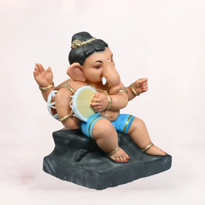 Front side profile view of handcrafted Damru Bal Sky Blue Dhoti 20 Inch Eco-Friendly Ganpati Idol made from natural Shadu Mati clay.