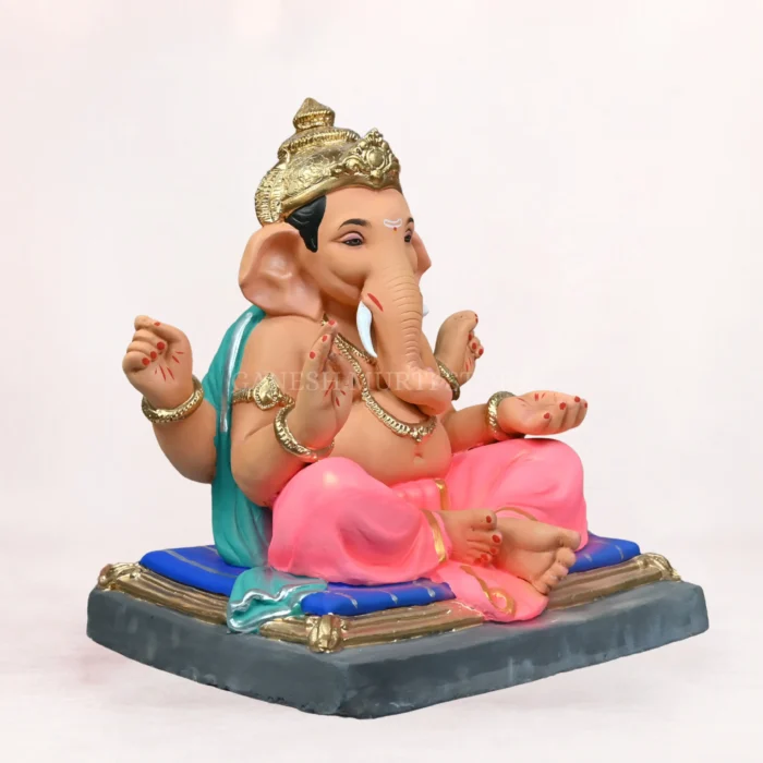 Front side profile view of handcrafted Gattu Aasan Pink Dhoti 20 Inch Eco Friendly Ganpati Idol made from natural Shadu Mati clay.