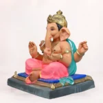 Front side angle view of handcrafted Gattu Aasan Pink Dhoti 20 Inch Eco Friendly Ganpati Idol made from natural Shadu Mati clay.