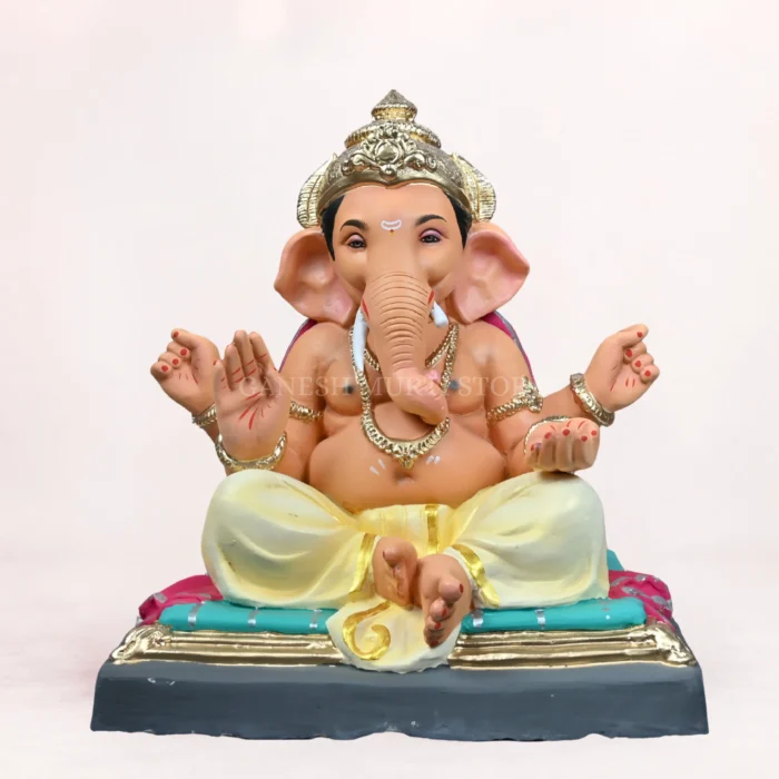 Gattu Aasan Yellow Dhoti 20 Inch Eco Friendly Ganpati Idol Handcrafted Gattu Aasan Yellow Dhoti 20 Inch Eco Friendly Ganpati Idol made from natural Shadu Mati clay.