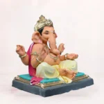 Front side profile view of handcrafted Gattu Aasan Yellow Dhoti 20 Inch Eco Friendly Ganpati Idol made from natural Shadu Mati clay.