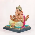 Front side angle view of handcrafted Gattu Aasan Yellow Dhoti 20 Inch Eco Friendly Ganpati Idol made from natural Shadu Mati clay.