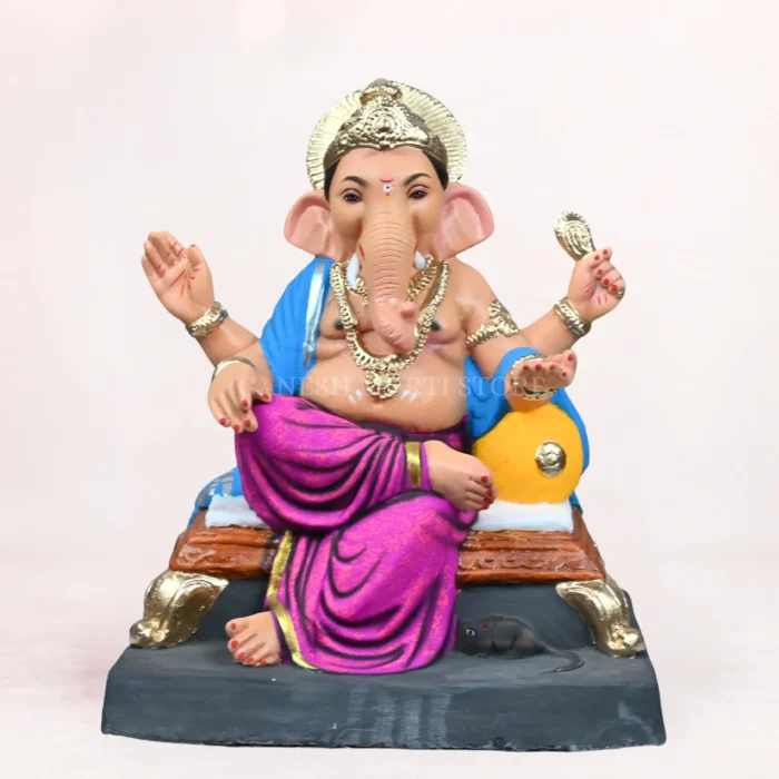 Koach Load Purple 18″ Inch Eco-Friendly Ganpati Idol Koach Load Purple 18 Inch Eco-Friendly Clay Ganpati Idol sitting on a decorative bolster (load) for Ganesh Chaturthi.