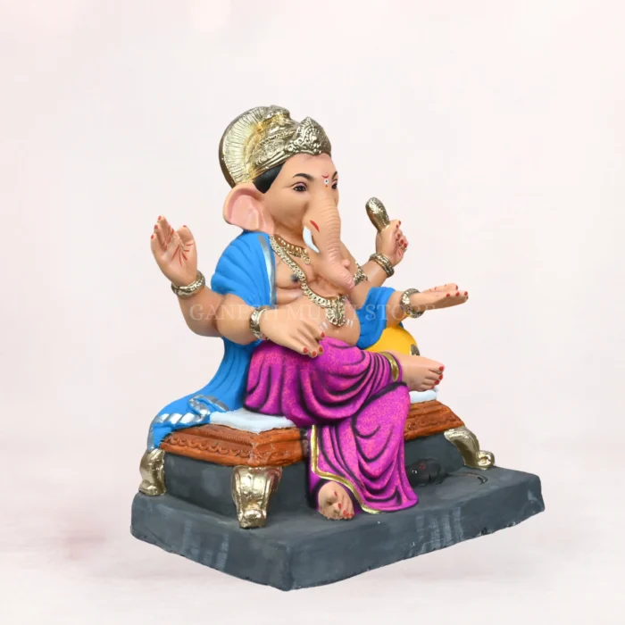 Koach Load Purple 18 Inch Eco-Friendly Clay Ganpati Idol sitting gracefully on a decorative purple bolster (load)