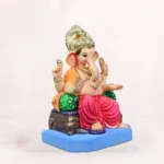 Side angle view of Maharaja Double Load Pink Dhoti 20 Inch Eco Friendly Ganpati Murti Idol showing one side of the decorative bolster