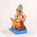 Front side profile view of handcrafted Philip Yellow Dhoti 20 inch Eco Friendly Ganpati Idol made from natural Shadu Mati clay.