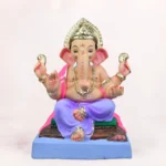 Front view of an eco-friendly 18 inch clay Ganesh idol with a light purple dhoti, seated on a decorative aasan, ideal for Ganesh Chaturthi celebrations.