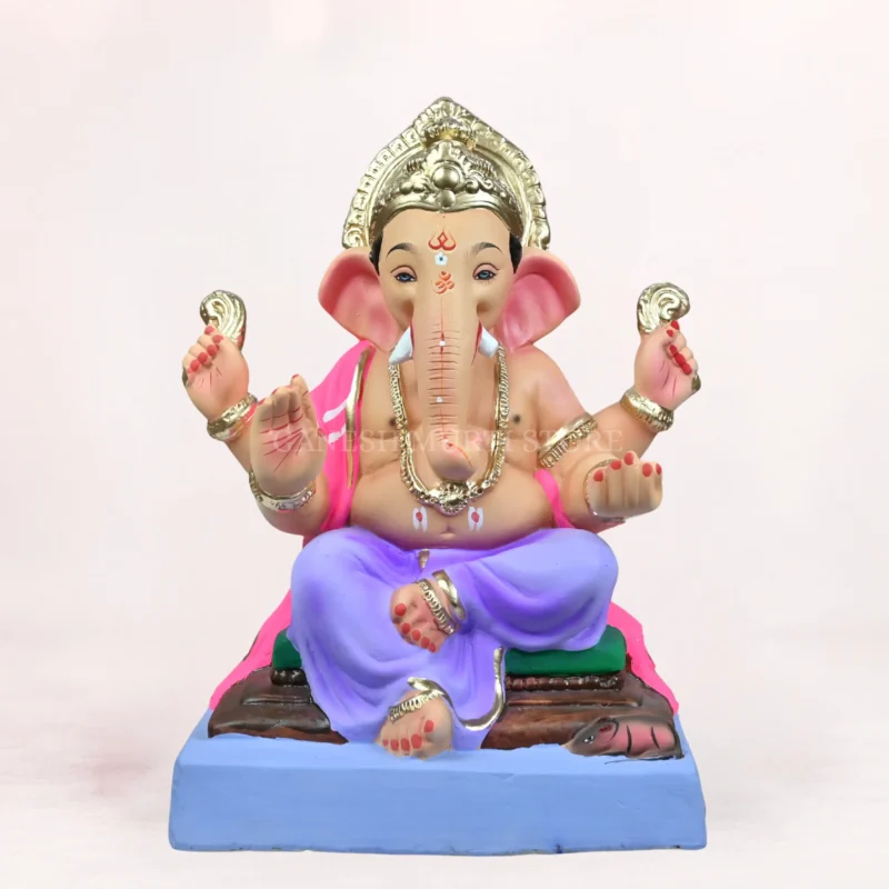 Front view of an eco-friendly 18 inch clay Ganesh idol with a light purple dhoti, seated on a decorative aasan, ideal for Ganesh Chaturthi celebrations.