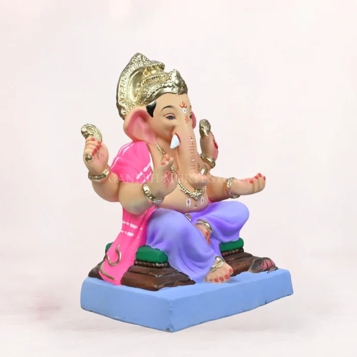 Handcrafted 18 inch eco-friendly clay Ganesh idol with a light purple dhoti, seated on a decorative aasan, designed for Ganesh Chaturthi celebrations.