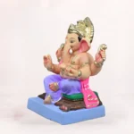 Handcrafted 18 inch eco-friendly clay Ganesh idol with a light purple dhoti, seated on a decorative aasan, designed for Ganesh Chaturthi celebrations.