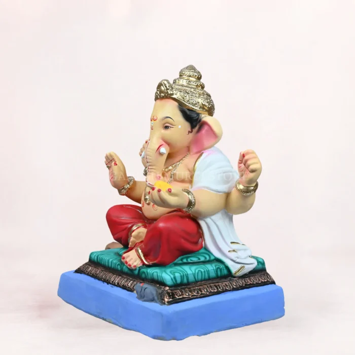 Front side angle view of handcrafted Philips Red Dhoti 20 Inch Eco Friendly Ganpati Idol made from natural Shadu Mati clay.