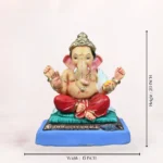 Zoomed-in close-up view highlighting the intricate ornaments and facial features of the Philips Red Dhoti 20 Inch Eco Friendly Ganpati Idol.